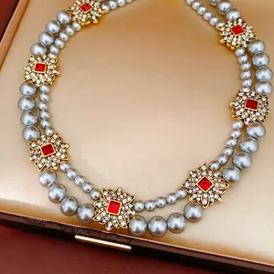 Elegant vintage double-strand grey pearl necklace with ruby-red floral spacers in gift box