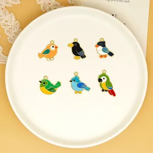 Detailed view showing six colorful enamel bird charms for DIY jewelry making and keychains