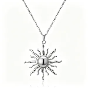 Minimalist silver sun pendant necklace with curved flame rays on polished chain