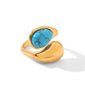 Macro detail of high-quality gold open ring featuring a marbled blue natural stone