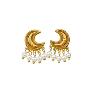 Vintage golden crescent moon earrings with elegant white pearl tassels on white background