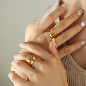 Irregular flowing gold rings set for women in minimalist stainless steel aesthetic