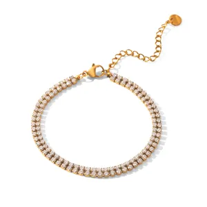 Detailed view of a gold-plated double-row zircon tennis bracelet with a lobster clasp.