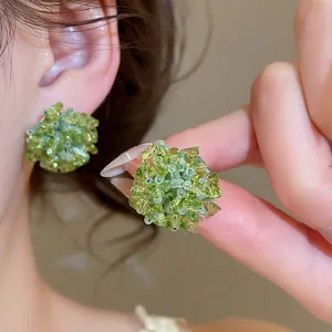 Handcrafted cluster stud earrings with green crystal beads and a floral woven design