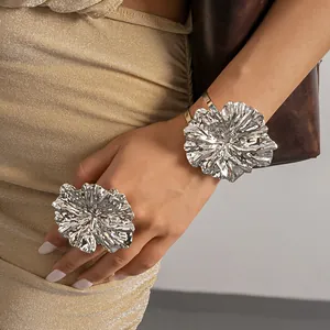 Silver metallic crumpled flower ring and cuff bracelet set with elegant pleated texture