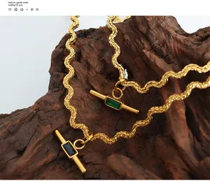 Macro shot of vintage twisted rope chain necklaces with green and black gemstones