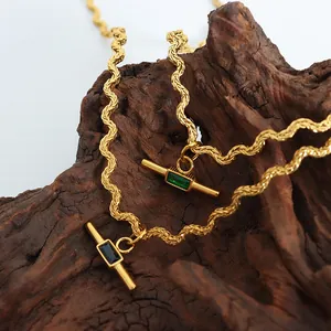 Golden titanium steel necklace with wavy chain and rectangular green gemstone pendant