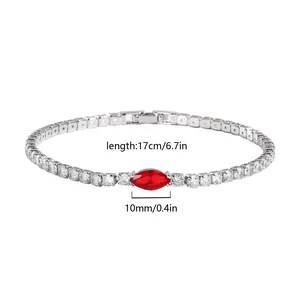 Detailed view of silver tennis bracelet with red marquise stone and length dimensions