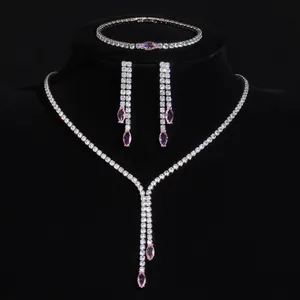 Luxurious zircon jewelry set with marquise pink stones presented on black velvet