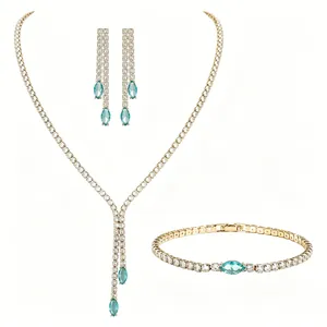 Detailed view of a luxury gold-plated jewelry set with marquise-cut teal stones and zircons
