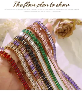 Macro detail of various colorful rectangle-cut zircon tennis bracelets in 18k gold plating