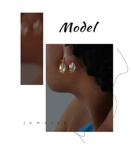Macro detail of gold marquise-cut zircon stud earrings with premium stainless steel base