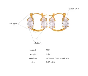 Detailed view of titanium steel hoop earrings featuring marquise-cut glass crystals