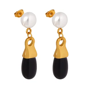 Elegant French-style gold drop earrings featuring a white pearl and black teardrop pendant