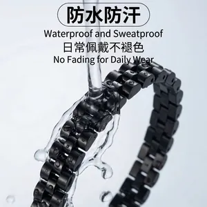 Detailed view of black stainless steel link bracelet under a running water splash test