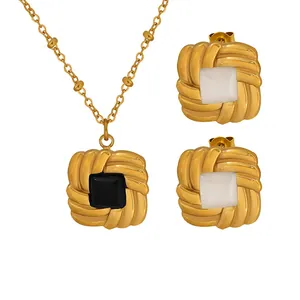 French hammered gold jewelry set featuring square black and white pendant necklace and earrings