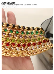 Detail view of gold-plated Cuban chains with multi-colored square-cut zircon stones