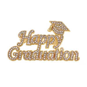 Detailed view of an elegant gold 'Happy Graduation' brooch decorated with rhinestones