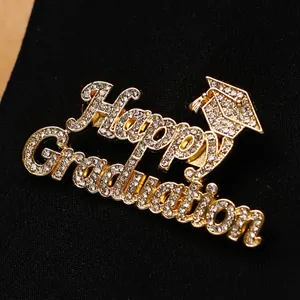 Gold-plated Happy Graduation brooch with sparkling crystals and a doctor cap design