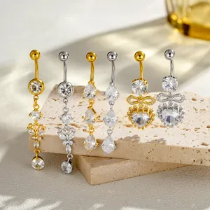 Elegantes piercings de ombligo con circonita y diseños de corazón y lazo en oro y plata