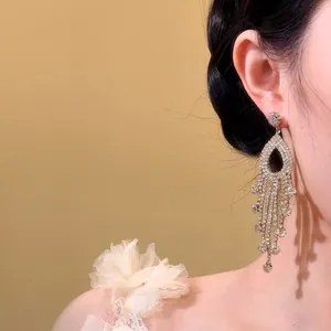 Detailed view of elegant French-style dangling tassel earrings with sparkling rhinestones