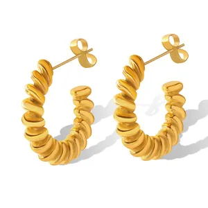 Retro golden twisted C-shaped hoop earrings with croissant texture in polished steel