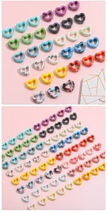 Macro view of assorted colorful marble texture heart-shaped hollow ceramic beads