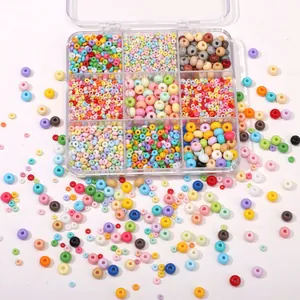 Macro detail of high-quality glass seed beads organized in a nine-grid storage box for DIY
