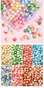 Detailed view of colorful marble textured beads set with a plastic storage organizer box