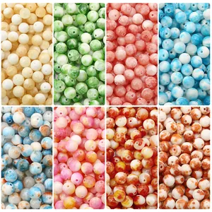 Assorted colorful round beads for DIY jewelry making in eight different stone patterns