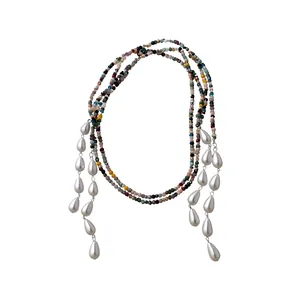 Vintage ethnic style necklace featuring colorful handmade beads and white teardrop pearls