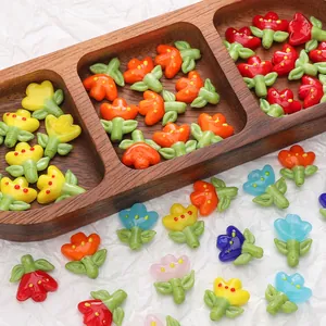Colorful tulip glass beads in a wooden tray for DIY jewelry making and bracelets