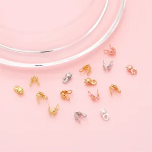 Macro view of 14K gold-filled crimp bead covers for DIY jewelry necklace making
