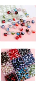 Macro shot of colorful glass crackle beads for DIY jewelry making in storage box