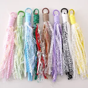Close-up of handmade polyester lace tassels in 8 colors with alloy keyrings and spring clasps