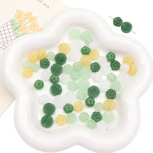 DIY jewelry beads set with traditional Fu symbols and flowers in a white petal tray