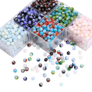 Colorful gradient crackle glass beads set for DIY jewelry making in a plastic organizer box