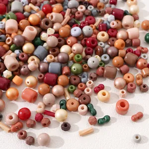 Mix of colorful glass beads in round and flat shapes for DIY necklace jewelry making