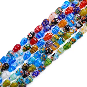 Handmade millefiori glass teardrop beads with vibrant floral patterns for DIY jewelry