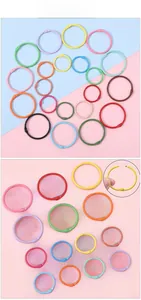 Macro detail of colorful metal loose-leaf binder rings with manual opening mechanism