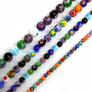 Detail of colorful millefiori glass beads for jewelry making showing flower patterns