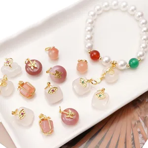 Traditional 14K gold plated pearl bracelet with jade safety buckle and diverse charms