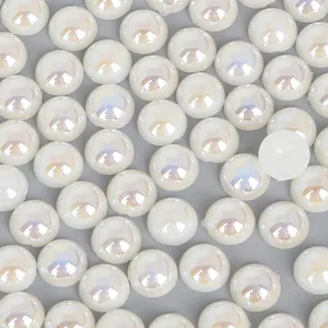 Close-up of iridescent cream white half round ABS imitation pearls for DIY crafts