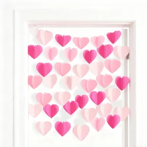 Detail of 3D pink and burgundy heart-shaped paper garlands for wedding party decor