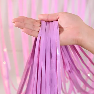 Close-up of lavender purple metallic tinsel fringe curtain showing texture and shine
