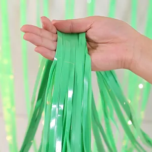 Detail of light green foil fringe curtain with high-gloss finish for party backdrop