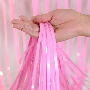 Pink metallic foil fringe curtain for party backdrops with shiny macaron tinsel finish