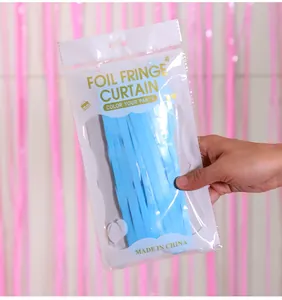 Light blue foil fringe curtain in retail packaging for party wall decoration