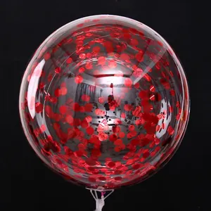 Detailed view of a transparent balloon filled with vibrant red confetti for weddings