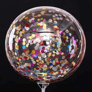 Macro shot of transparent 24-inch glitter balloon with colorful metallic sequins